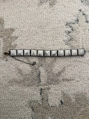 White Marble Pyramid Stud Bracelet with Dark Metal Chain Henri Bendel